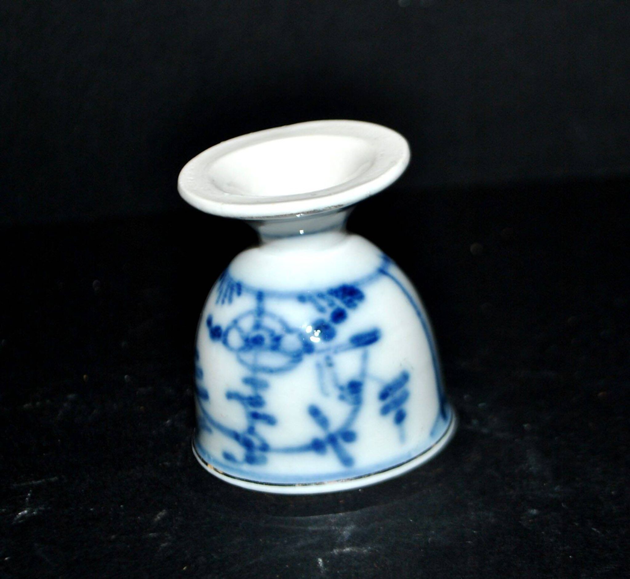 Antique porcelain diabolo egg cup with blue hand-painted onion decoration