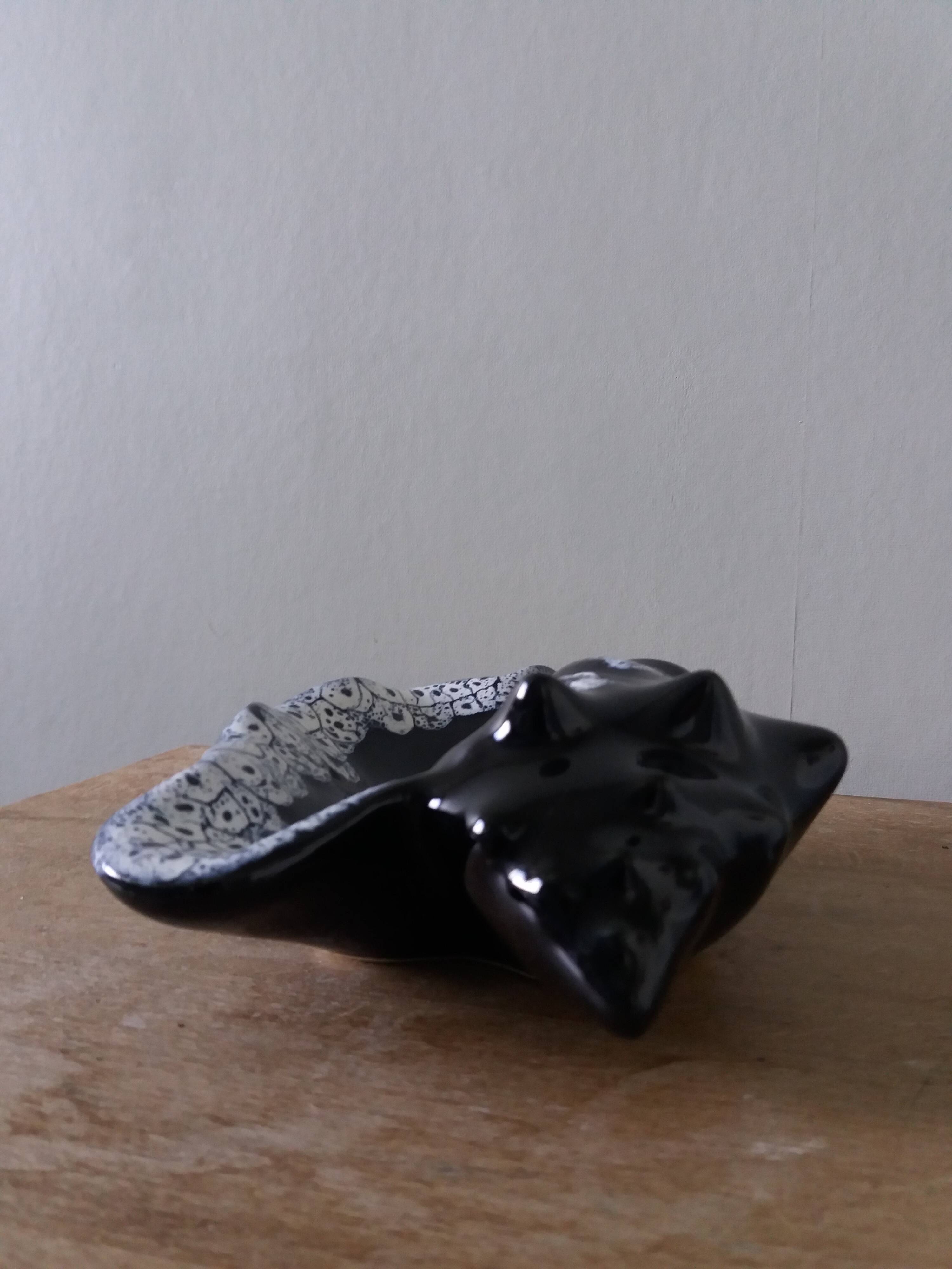 Black ceramic and foam shell ashtray