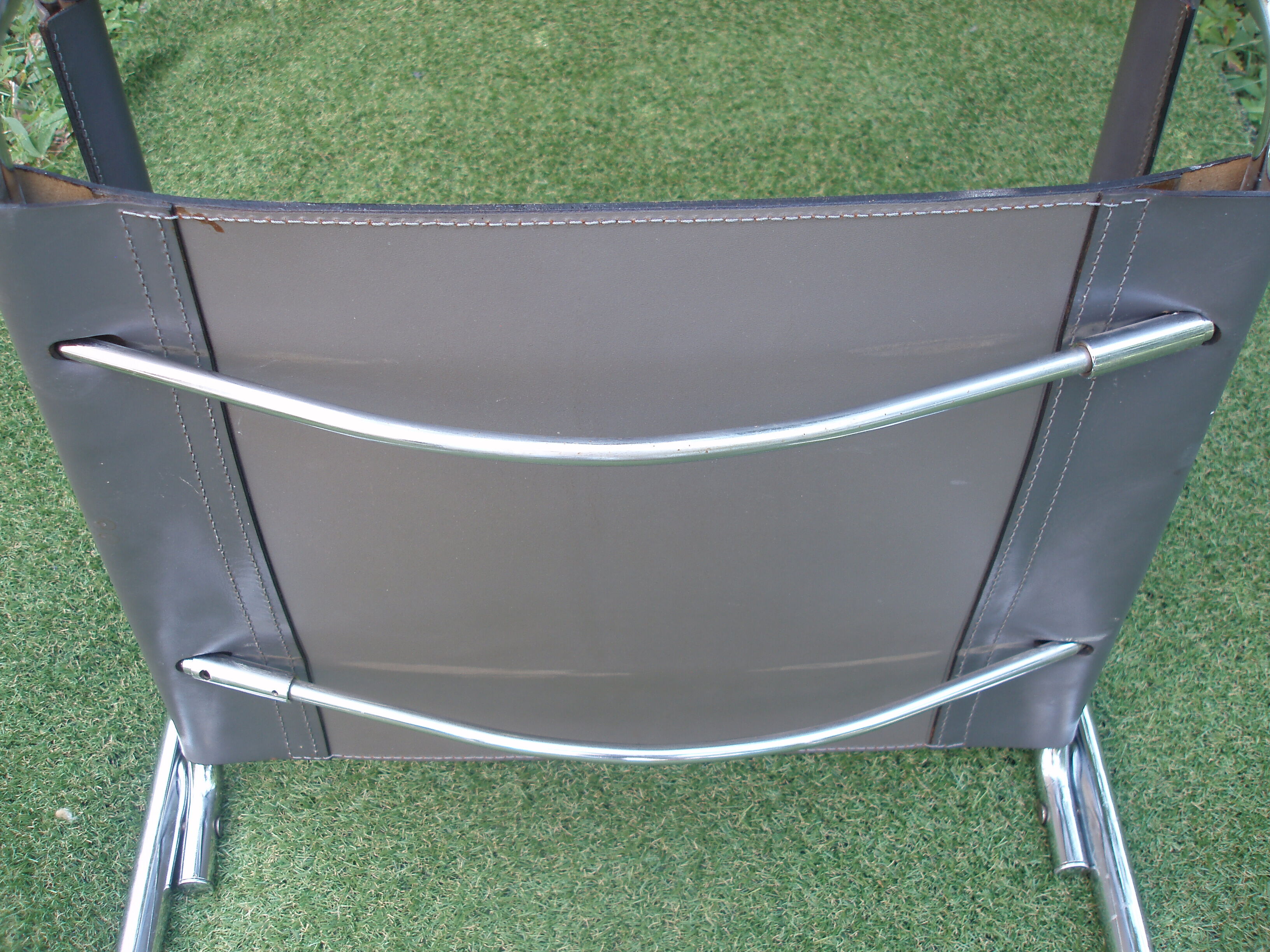 Series of grey and chrome leather armchairs