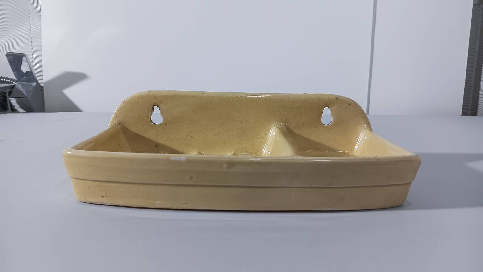 Pale yellow ceramic soap dish