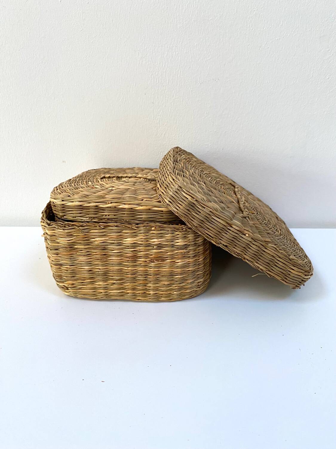 Vintage trio of small rattan nesting baskets