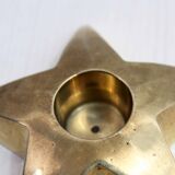 Star-shaped brass candle holder