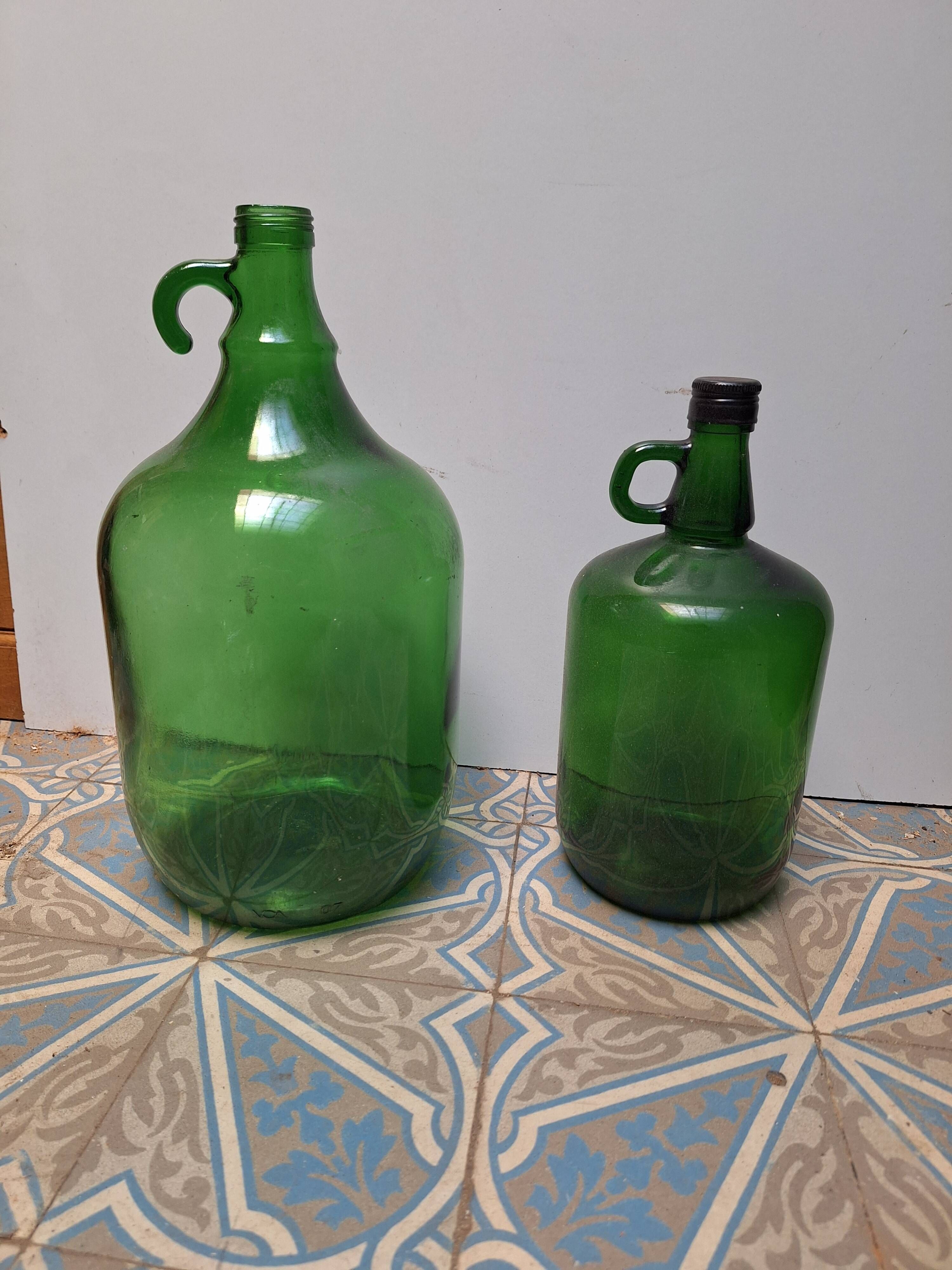 Set of 2 vintage green glass Demijohns.