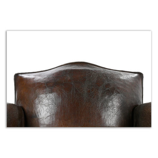 Club armchair and leather ottoman