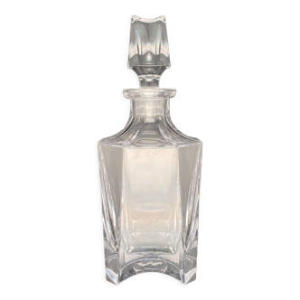 Clear glass carafe for strong alcohol with facets and worked stopper