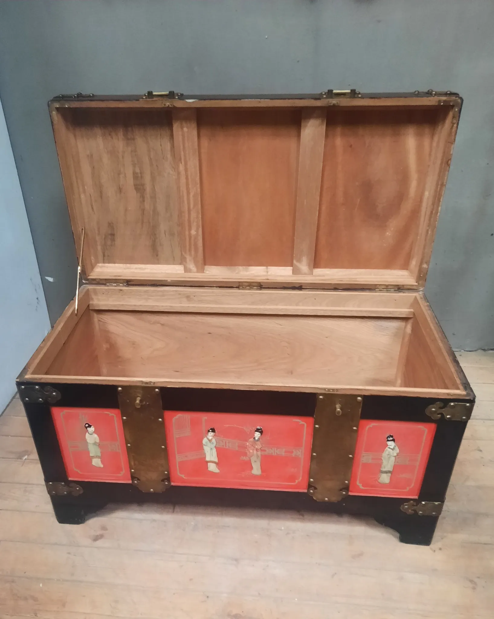 Red lacquered wooden mallet from the Far East.