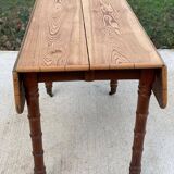 Louis Philippe 19th century square table with shutters in solid oak wood on casters