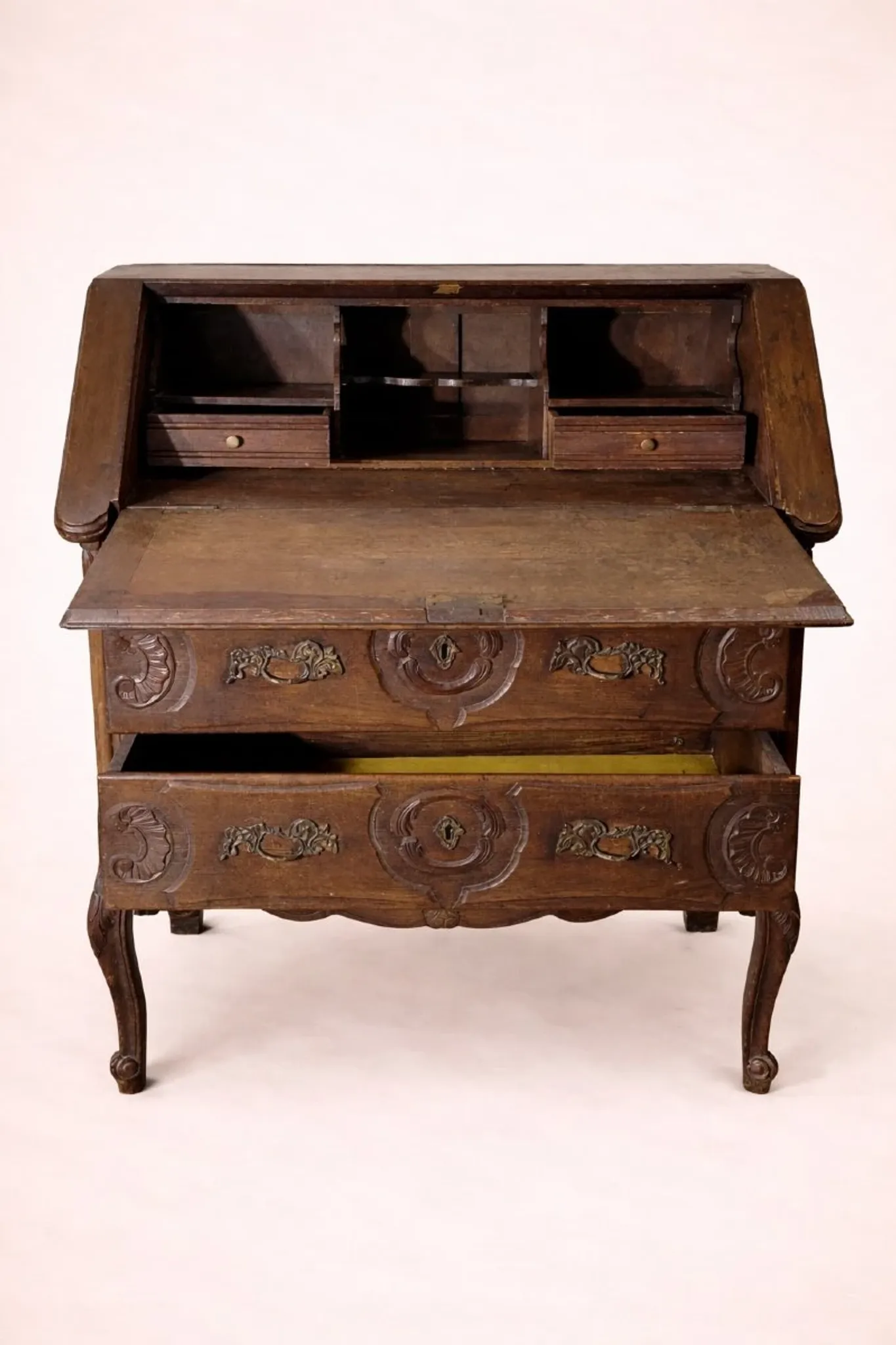 Antique solid wood secretary richly carved, in the Louis XV style.