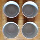 Lot of 4 bowls in sandstone and shiny grey inside