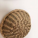 Wall composition of seven baskets and wicker trays