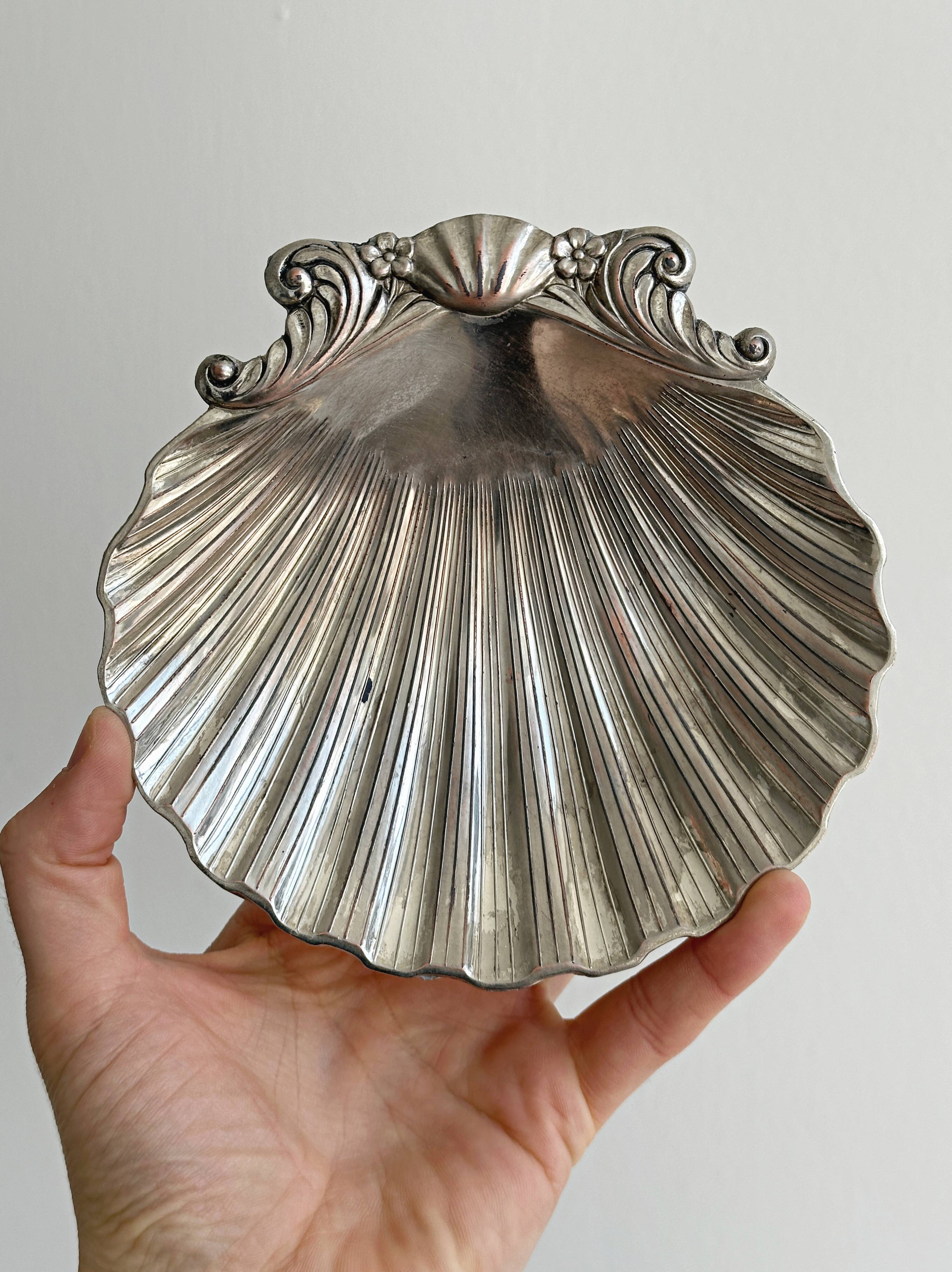 shell-shaped metal pocket tray with patina