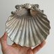 shell-shaped metal pocket tray with patina