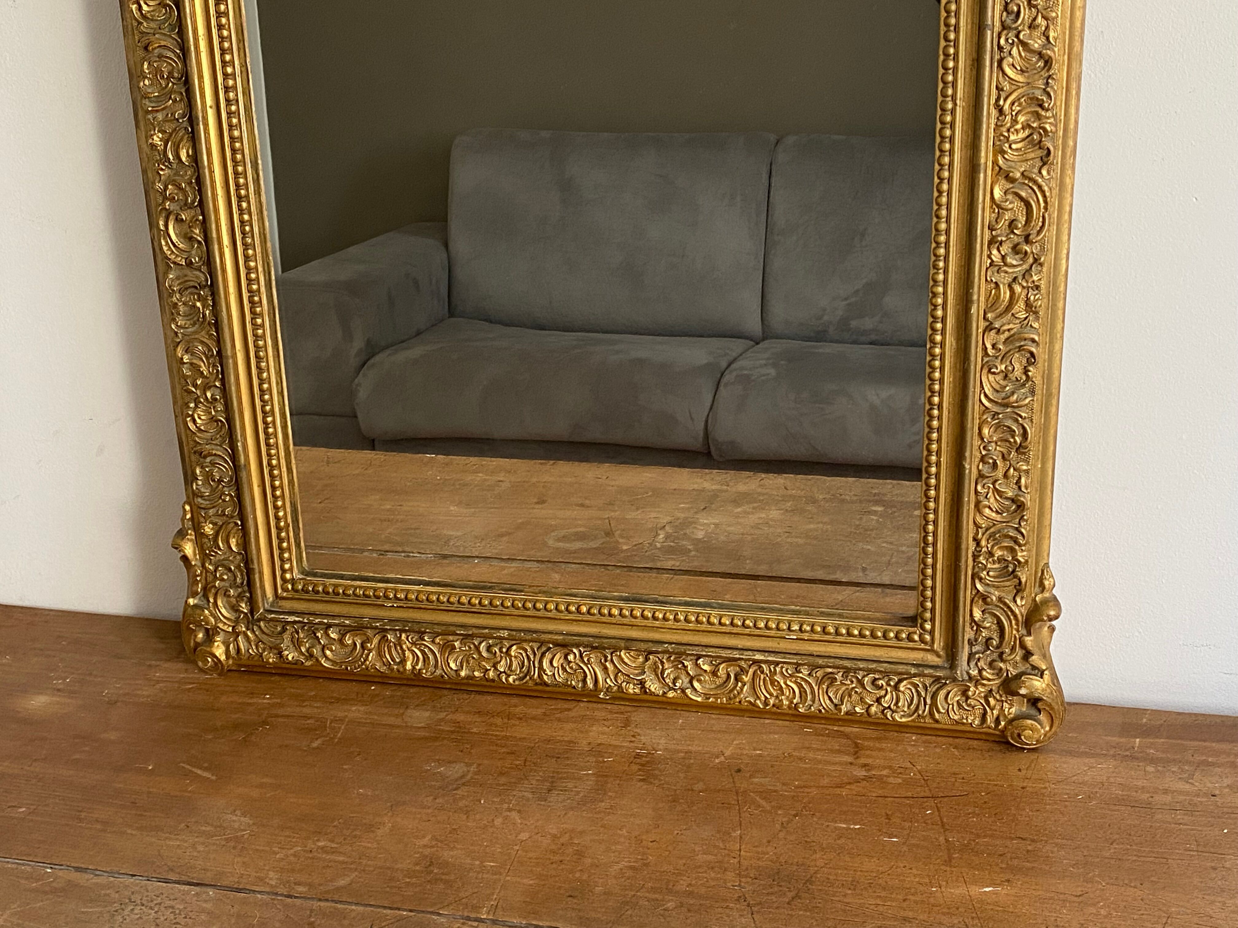 Late 19th century gilded mirror with decorated pediment 125x70cm