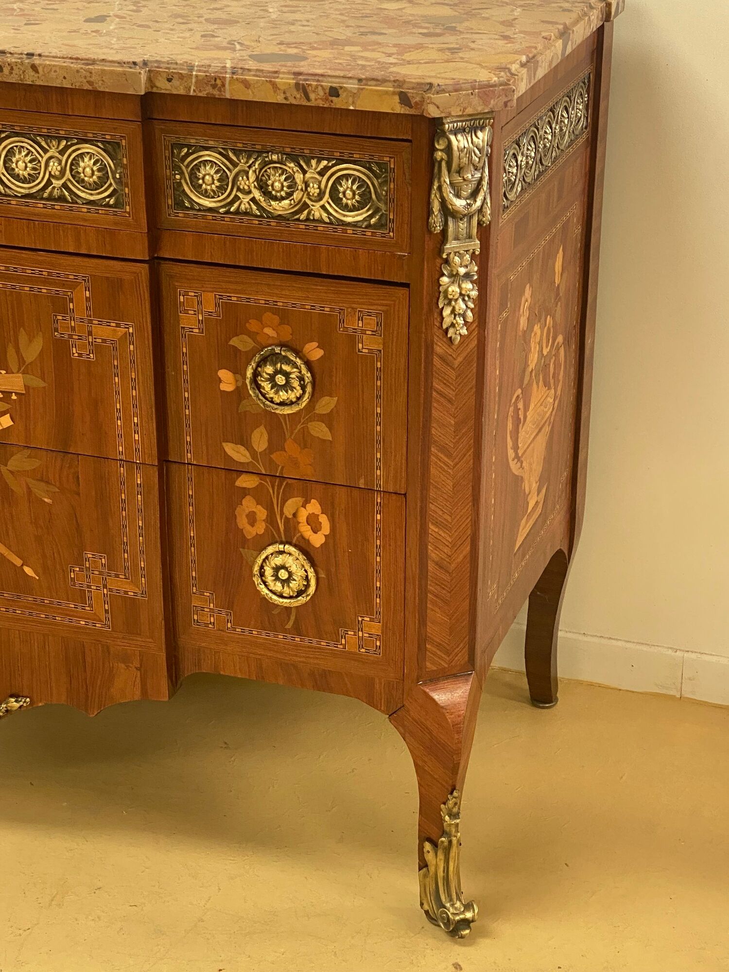 Transition chest of drawers with floral marquetry and music trophy