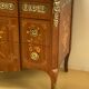 Transition chest of drawers with floral marquetry and music trophy