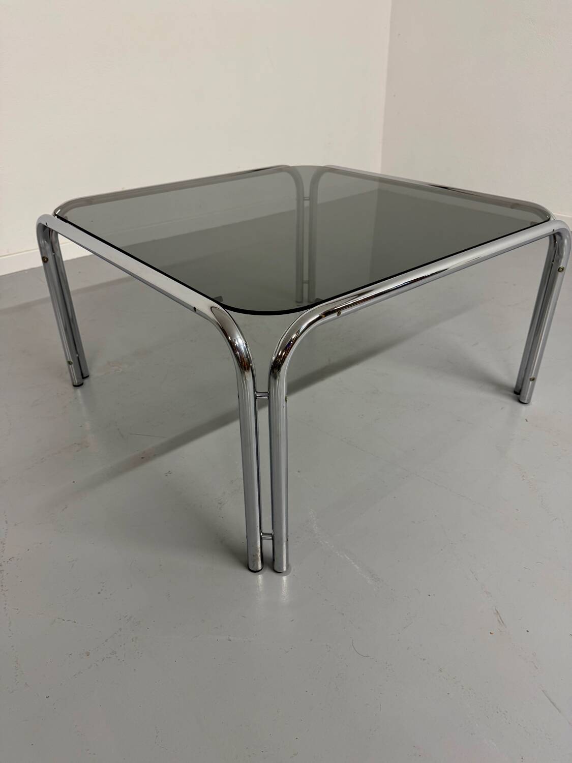 Space coffee table from the 70s, tubular metal and vintage smoked glass