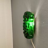 Old wall lamp made of hard pressed green glass.