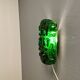 Old wall lamp made of hard pressed green glass.