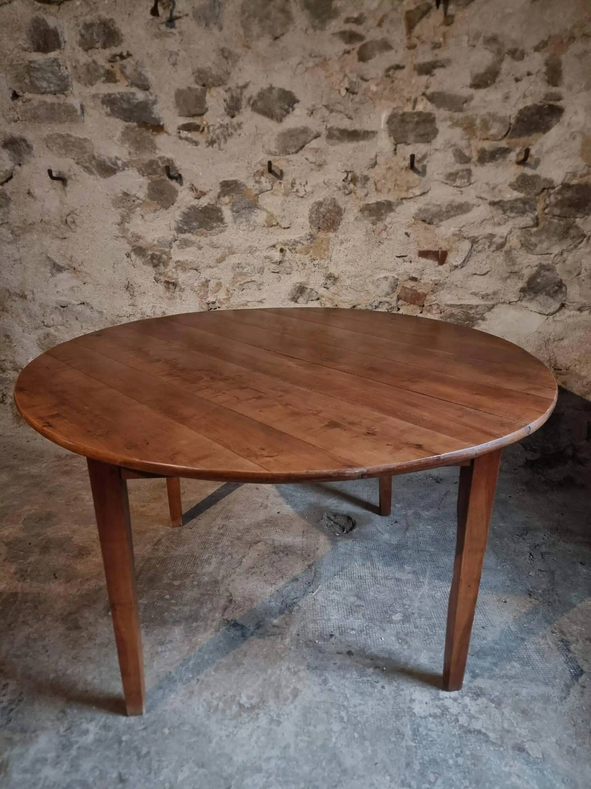 Antique round dining table in cherry wood, France, circa 1920.