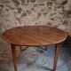 Antique round dining table in cherry wood, France, circa 1920.