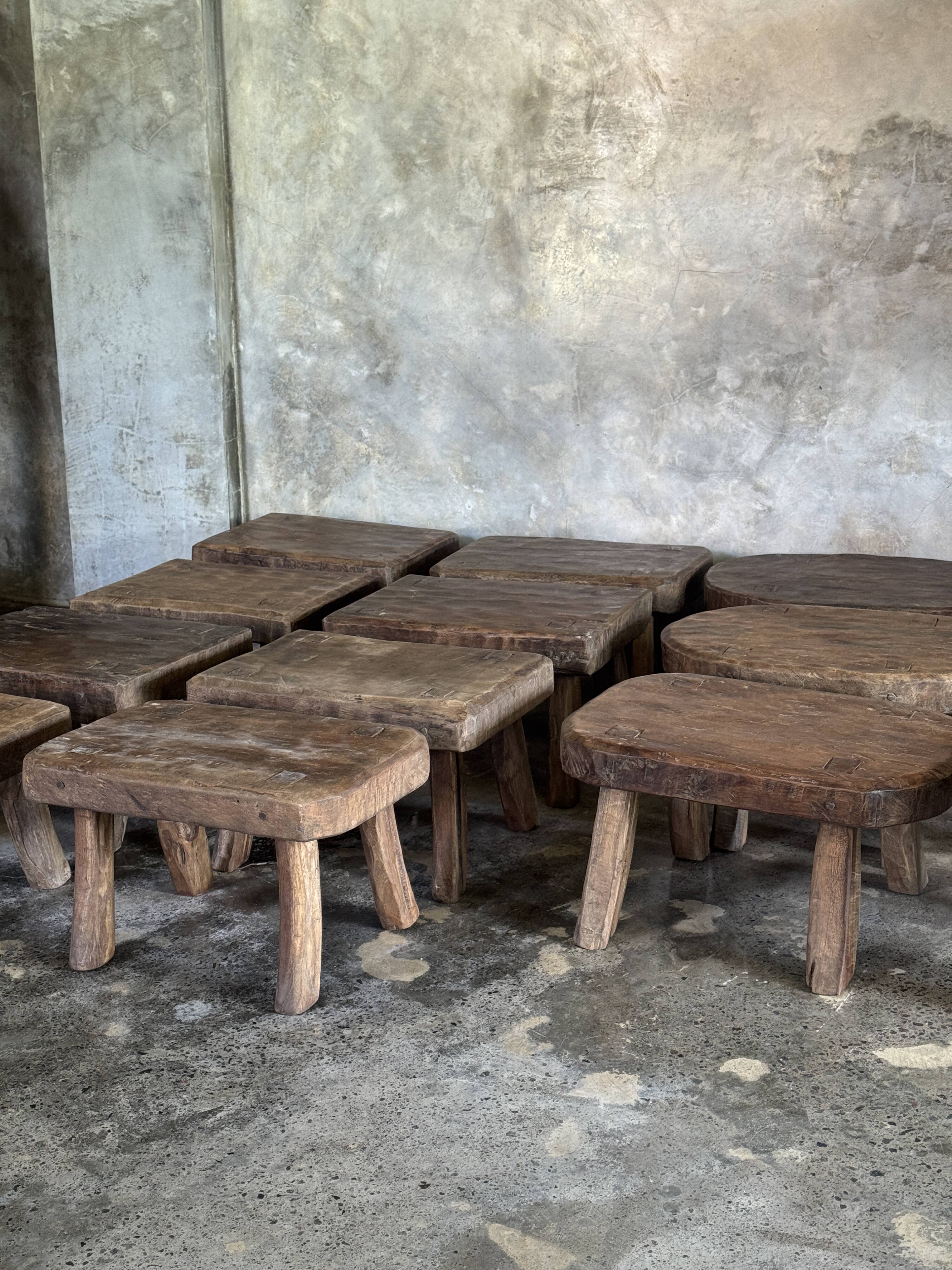 Small stool, rectangular solid teak side table with curved legs.