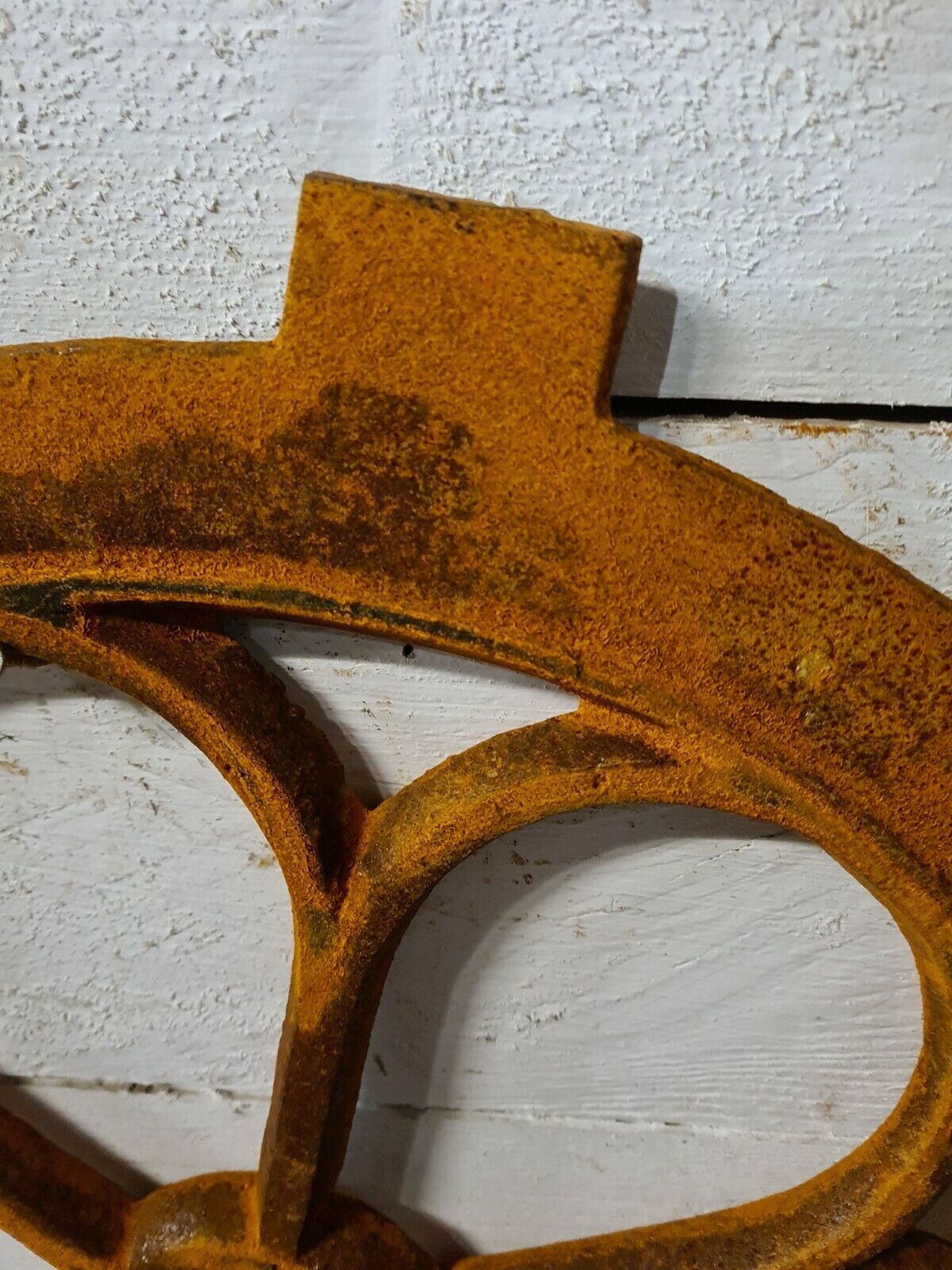 Cast iron ox's eye window in the shape of a flower