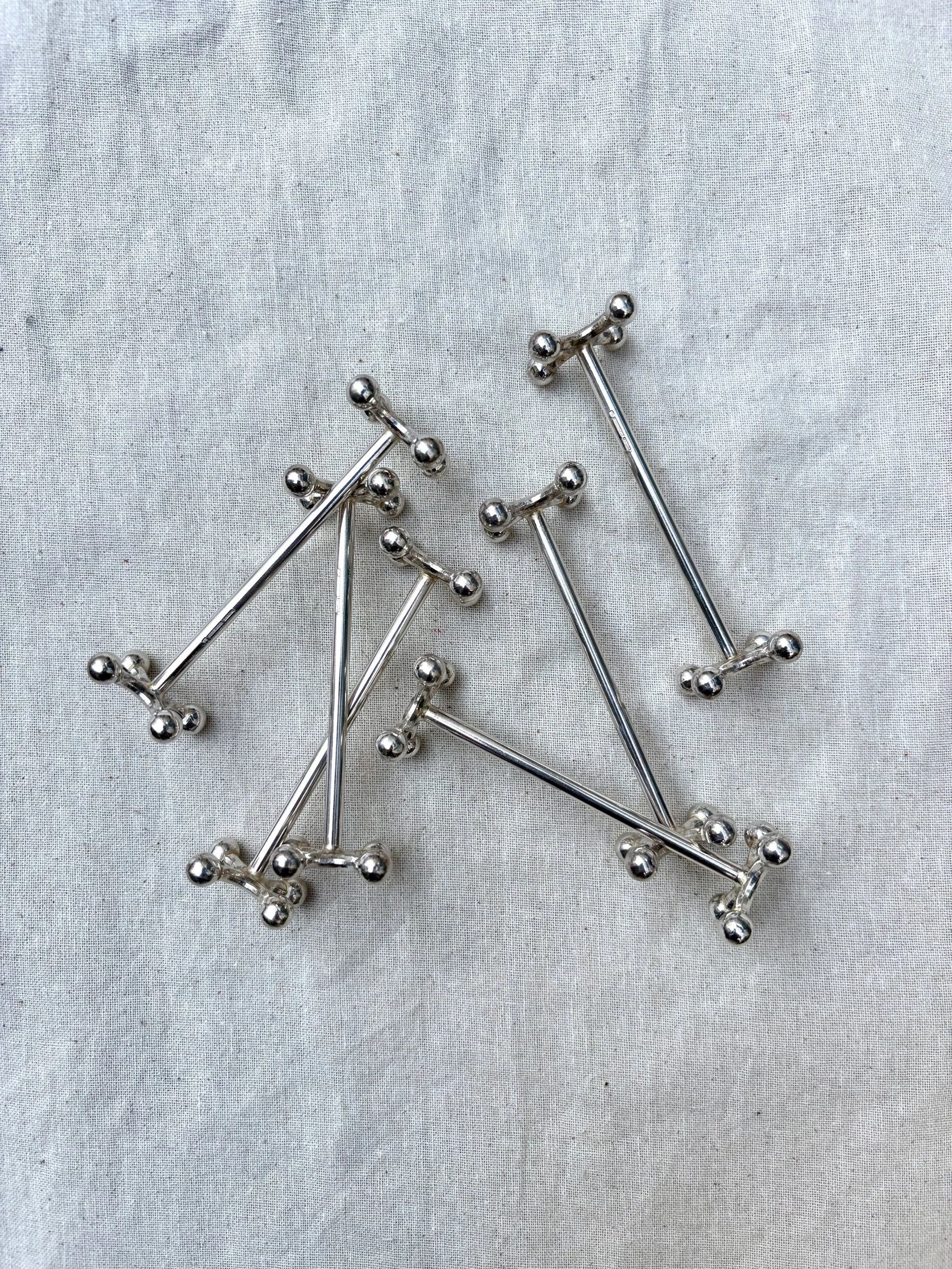 6 Christofle silver-plated knife rests