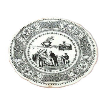 Plate "rebus" Gien earthenware After the soup a glass of wine removes a coin from the...