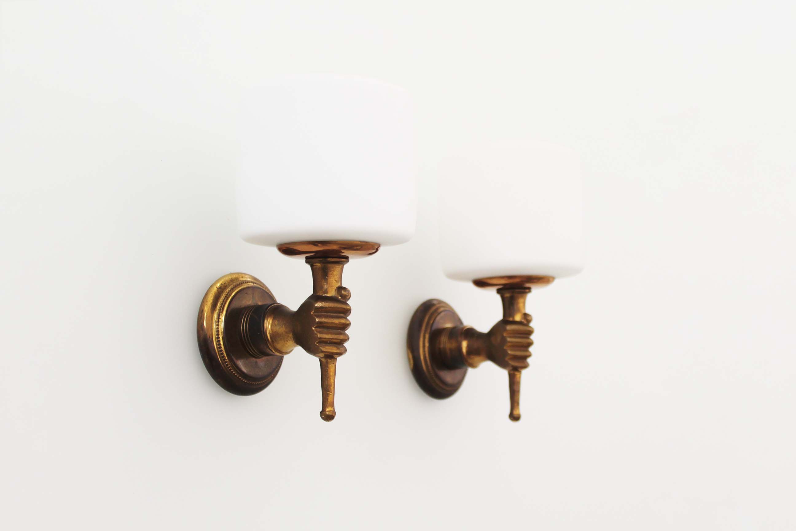 Pair of 1950’s solid brass ‘torch holding hand’ wall sconces by maison arlus
