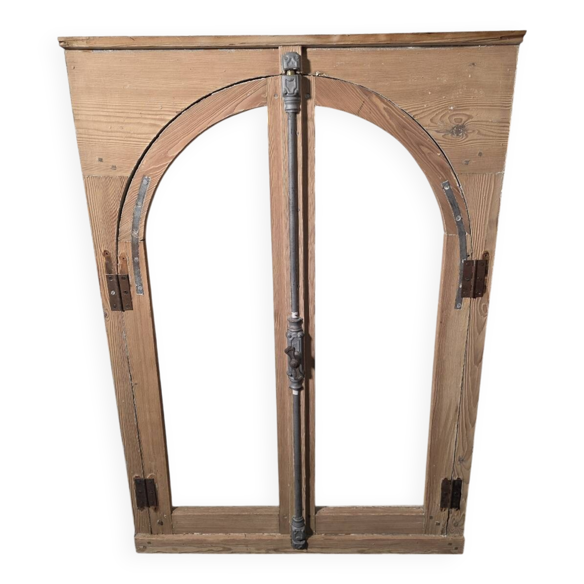 Old arched window made of fir wood