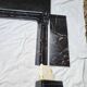 Pompadour fireplace with black marble modillions