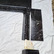 Pompadour fireplace with black marble modillions