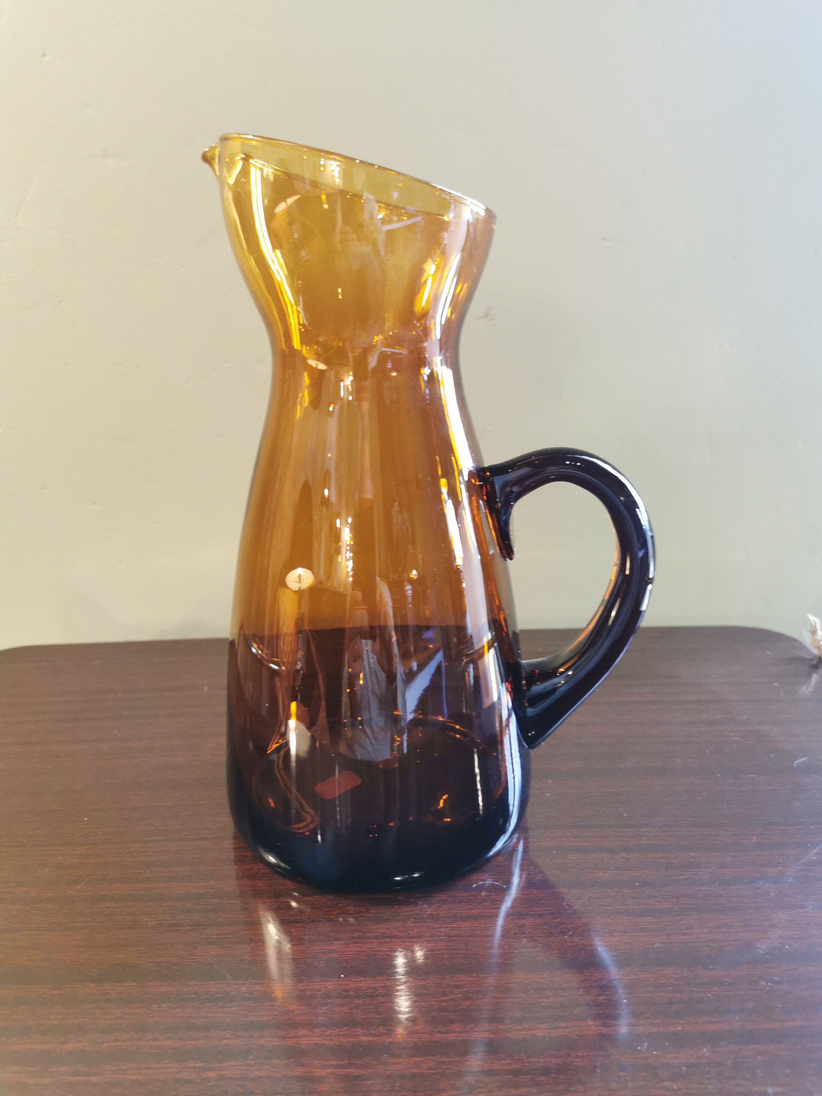 Vintage pitcher in amber glass