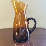 Vintage pitcher in amber glass
