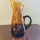 Vintage pitcher in amber glass