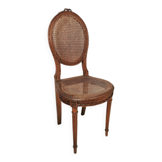 Antique chair Louis XVI style, seat caned, carved wood