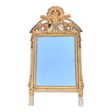 Antique mirror with gilded wood pediment, Louis XVI style