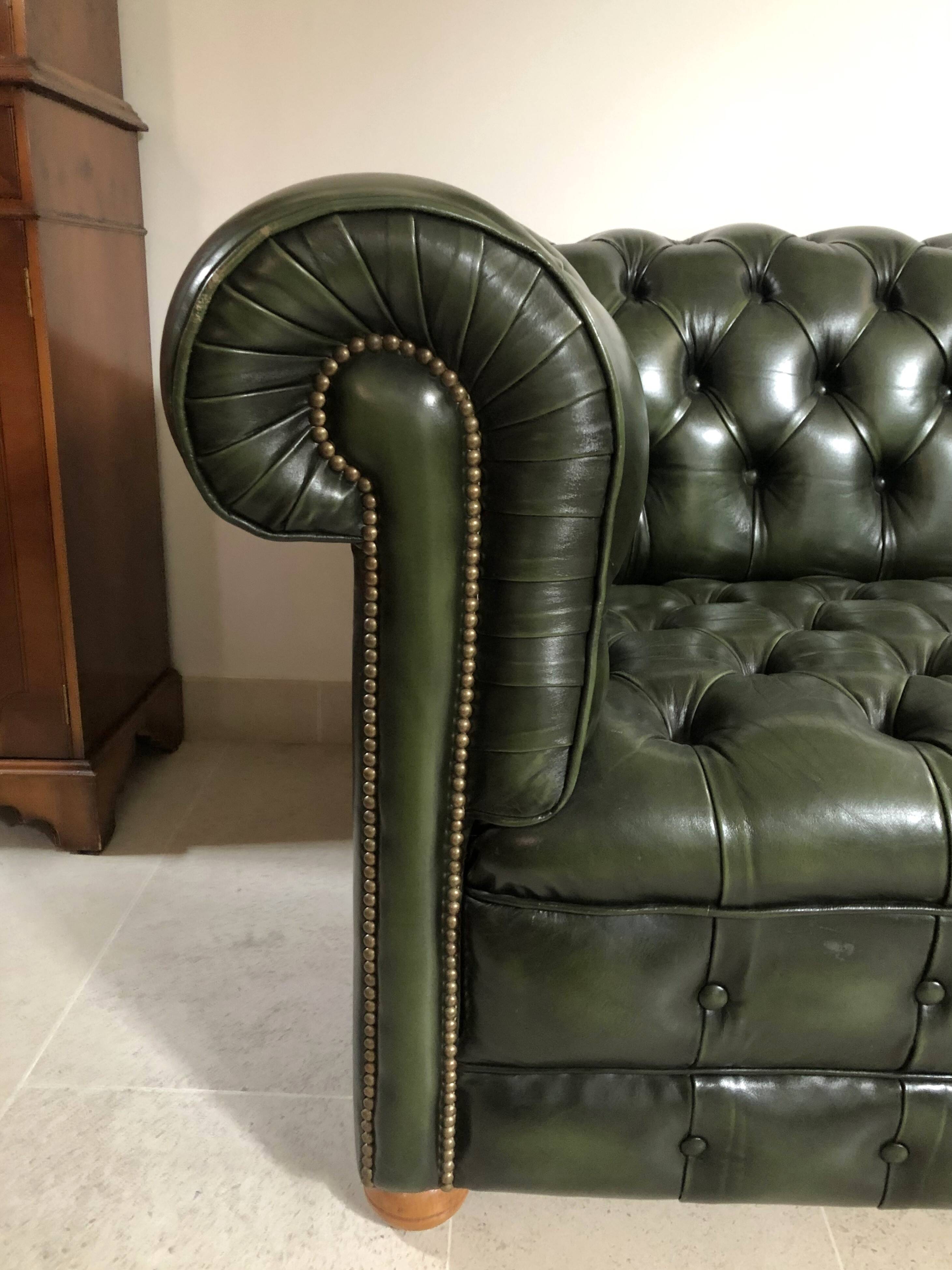 Patinated green English Chesterfield sofa