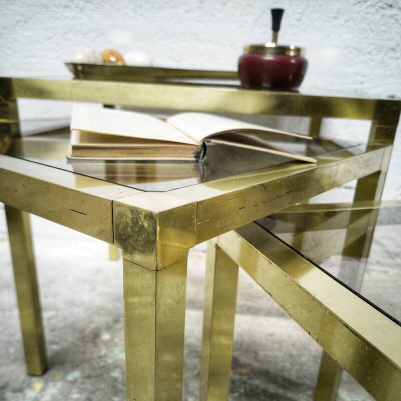 Trio of nesting tables in brass and smoked glass