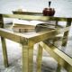 Trio of nesting tables in brass and smoked glass