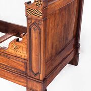 Bed made of solid walnut with marquetry details. France, 1930s.