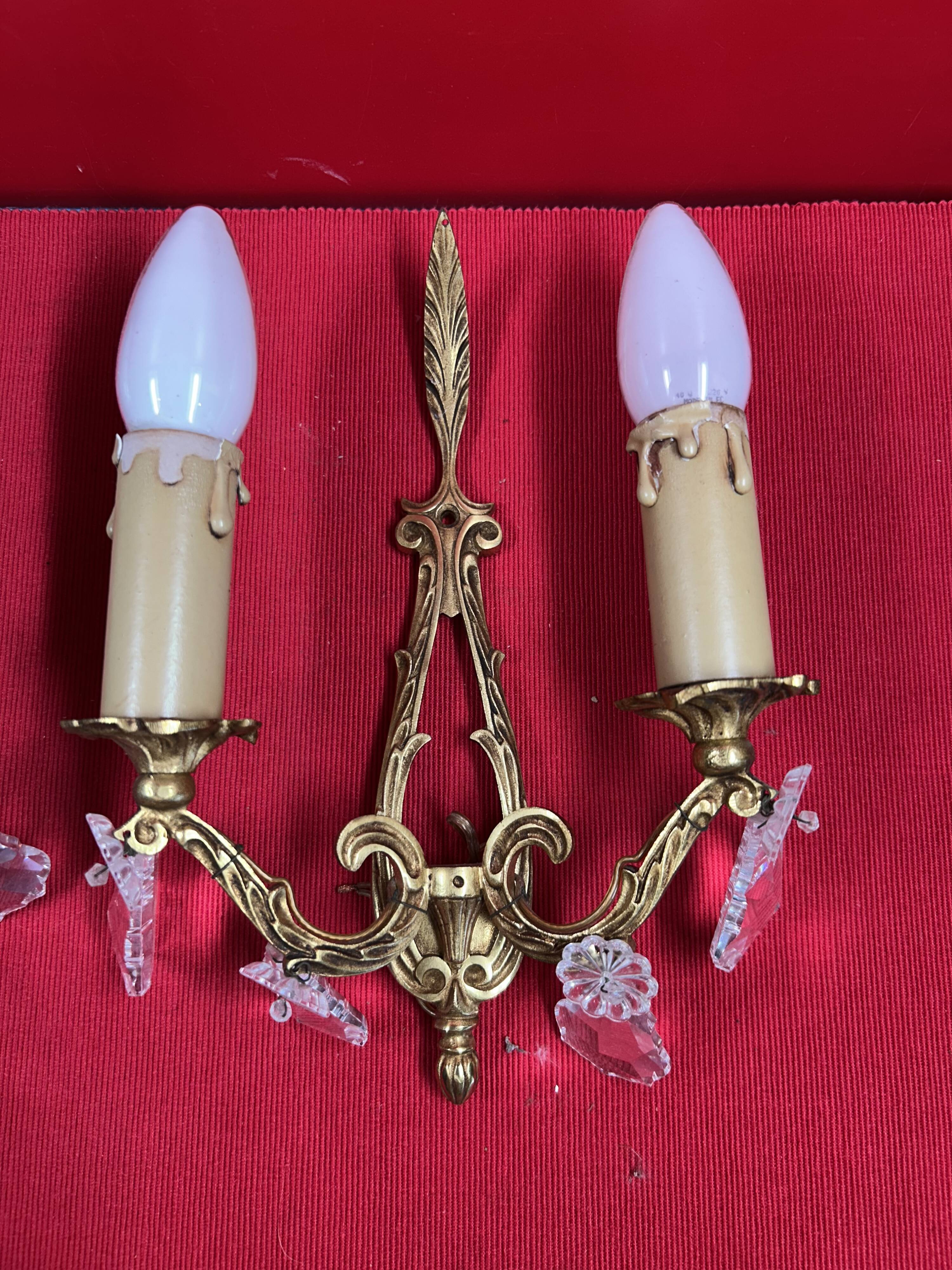 Pair of Louis XVI style wall lights, gilded bronze