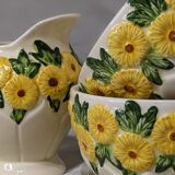 Sunflower flower cups and milk jug