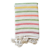 Moroccan plaid made of handwoven wool, decorated with stripes and pom poms.