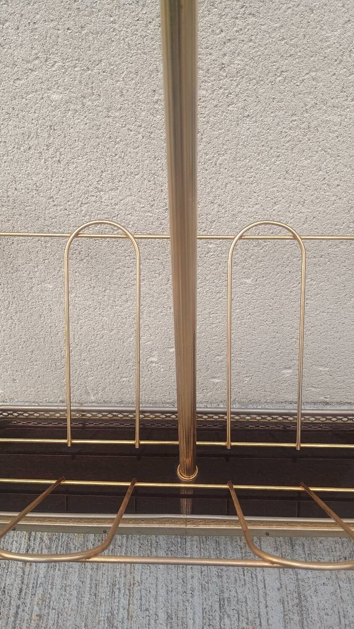 1960s brass folding magazine rack with lacquered wood decoration.