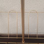 1960s brass folding magazine rack with lacquered wood decoration.