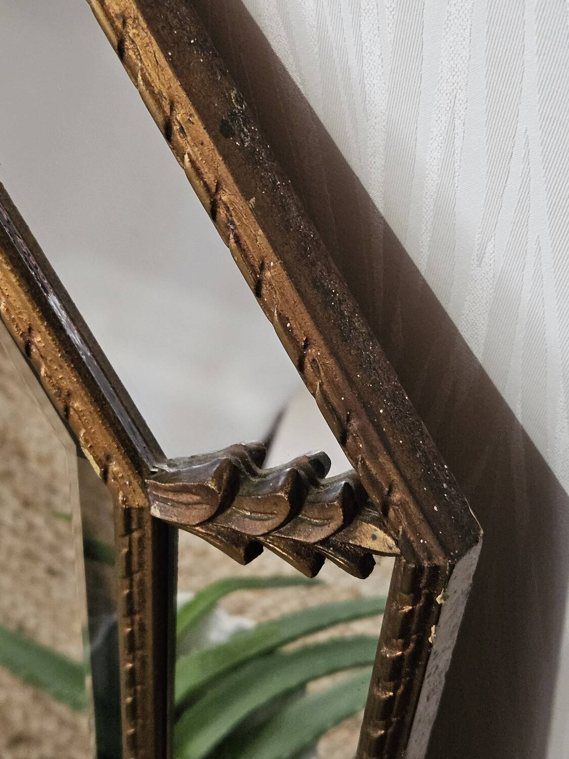Bevelled mirror with neoclassical parcloses from the 20th century.
