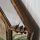 Bevelled mirror with neoclassical parcloses from the 20th century.