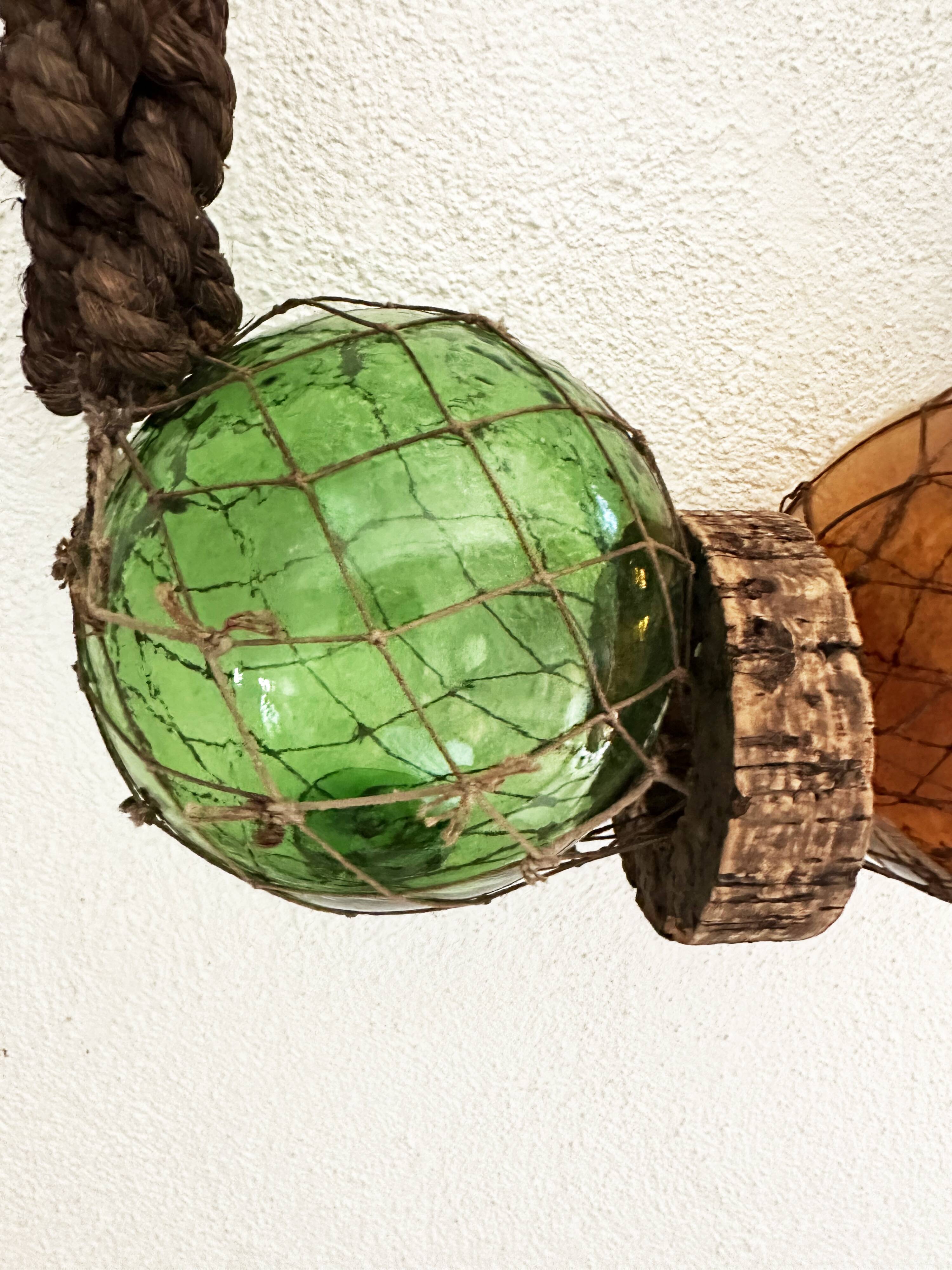 Fishing floats made of blown glass, cork, and rope. France, 1960s.