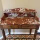Art Deco console in walnut and marble.